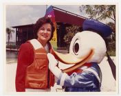 Elizabeth Dole and Disney's Donald Duck wearing life jackets